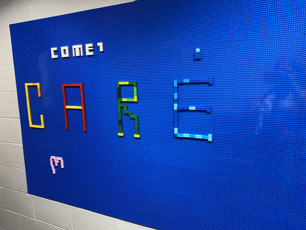 Comets Care Spelled out on Lego Wall
